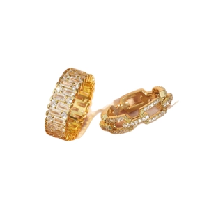 Dual layered gold-plated luxury rings set with micro-pave cubic zirconia on pink ribbon