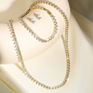 Golden hip-hop jewelry set with necklace, bracelet and earrings paved in pear-cut zircons