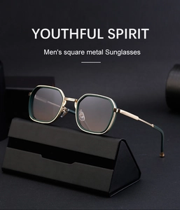 Detail of square metal sunglasses in gold and green finish with black triangle case
