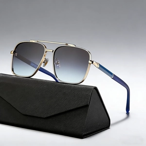 Golden aviator sunglasses with gradient lenses and a textured black folding case