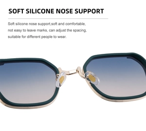 Detail of adjustable soft silicone nose pads on dark green square frame sunglasses