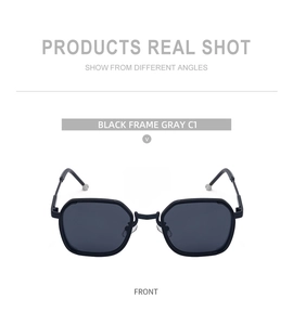 Detail view of square black matte sunglasses with silver temple tips and grey lenses