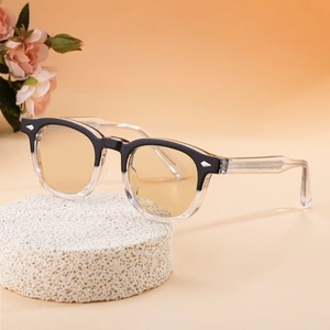 Fashionable square color-changing sunglasses with black transparent frames and silver rivets