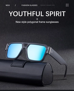 Macro detail of polygonal sunglasses with blue mirrored lenses on a black case