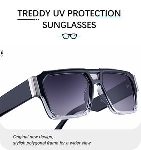 Detail of sunglasses featuring silver metal T-decorations on large black temples