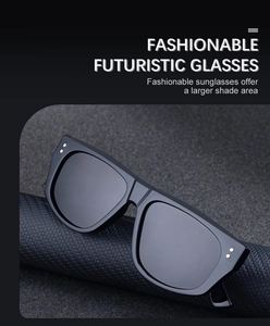 Detail of futuristic flat-top sunglasses with square frames and metal decorative dots