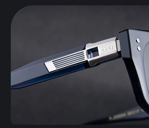 Detailed close-up of the metal hinge and engraved size on cat-eye sunglasses