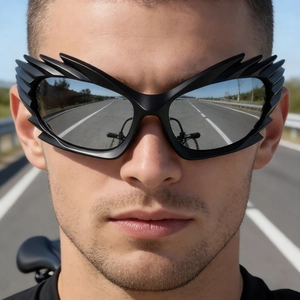 Front close-up of futuristic wing-shaped sports sunglasses with silver mirrored lenses