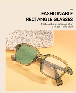 Detail of square olive green acetate sunglasses with gradient lenses on a stone prop