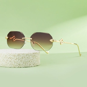 Fashionable rimless octagonal sunglasses for women with snake-shaped golden metal temples