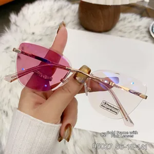 Detail of rimless photochromic sunglasses with blue light blocking lenses and gold frame
