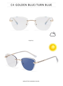 Detail of cat-eye photochromic sunglasses with gold frames and blue crystal temple accents