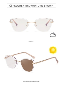 Close-up of cat eye sunglasses with photochromic lenses and diamond-studded gold temples