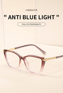 Close-up of cat-eye frames featuring blue light blocking lenses and gold textured temples