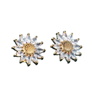 Detailed close-up of golden sunflower stud earrings with marquise-cut zircon petals