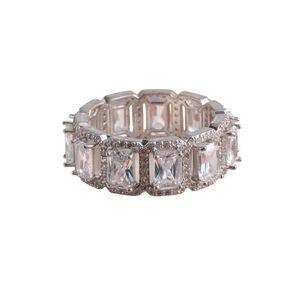 Macro shot of silver ring with emerald-cut zirconia stones and micro-pave detailing
