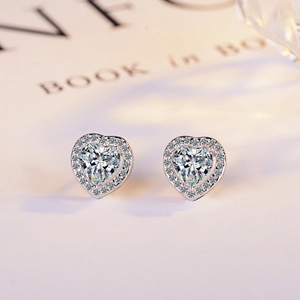 Elegant heart-shaped zircon stud earrings with silver-tone halo setting for wedding