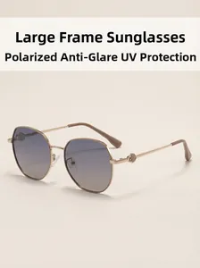 Detail of square gold metal frame sunglasses with gradient lenses and UV protection