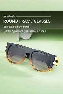 Gros plan de lunettes de soleil carrées avec accents dorés et verres dégradés