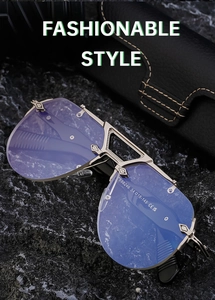 Detailed close-up of steampunk rimless sunglasses with gold engraved metal bridge and hinges