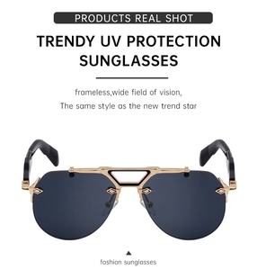 Close-up of frameless steampunk sunglasses with golden metal bridge and UV protection