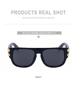 Détail de lunettes de soleil carrées noires avec décorations hexagonales dorées en métal