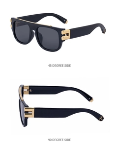 Vue détaillée des lunettes de soleil carrées avec barre dorée et charnières décorées