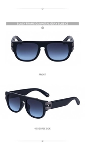 Lunettes de soleil carrées modernes avec verres dégradés bleu-gris et détails en métal