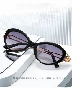 Close-up of cat-eye sunglasses temple showing the model 3262 and hollow gold metal joint