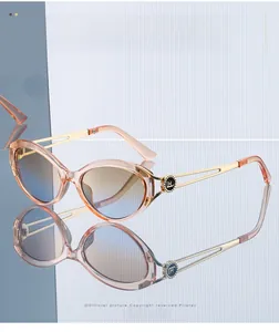 Close-up of cat-eye sunglasses with hollow metal temples and a gradient lens detail