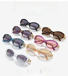 Detail of colorful oval cat eye sunglasses with metal hollowed temples in seven trendy colors