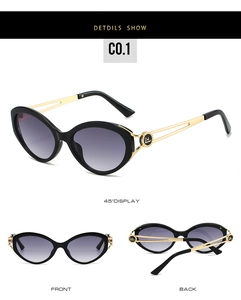 Detail view of cat eye sunglasses with purple gradient lenses and gold hollow temples