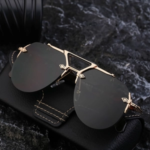 Steampunk rimless sunglasses with gold metal details on black textured leather case