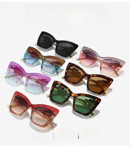 Macro detail of multi-color cat-eye sunglasses with heart-shaped metal temple accents