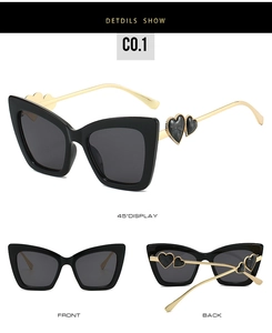 Detailed views of oversized cat-eye sunglasses with heart-shaped metal temple accents