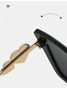 Detail of durable texture hinge on cat eye sunglasses with gold wavy metal temples