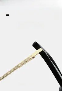 Detail of gold metal temples with honeycomb texture and spring hinge on cat-eye sunglasses