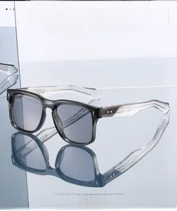 Detail of vintage sunglasses frame with translucent grey finish and metal wave engraving
