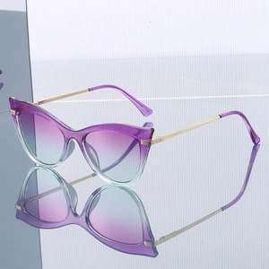Cat eye sunglasses for women with purple gradient lenses and gold metal spring legs