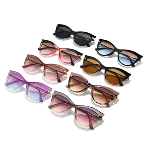 Eight pairs of trendy cat-eye sunglasses in various colors and metallic temple accents