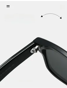 Macro shot of durable metal hinge and specification markings on retro black sunglasses