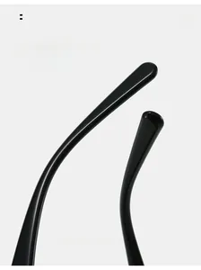 Detail of curved black sunglasses temples with a high-gloss finish for comfortable wear