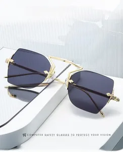 Detail showing rimless polygonal metal frame with unique bridge and dark lenses