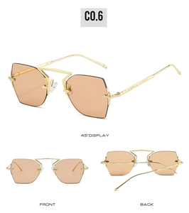 Detailed views of rimless polygonal metal sunglasses with orange lenses in gold finish