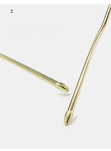 Detail of high-gloss gold metal curved temples with ergonomic non-slip design