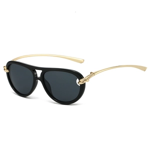 Lunettes aviateur chic avec design nœud et branches dorées sur fond blanc neutre