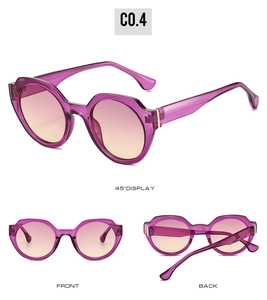 Detail view of irregular round sunglasses with purple frames and pink gradient lenses