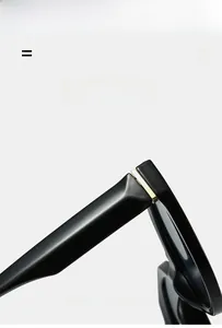 Detailed close-up of premium gold metal hinge on minimalist black round frame sunglasses