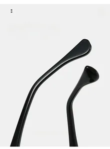 Detail of ergonomic curved mirror legs on high-gloss black resin sunglasses