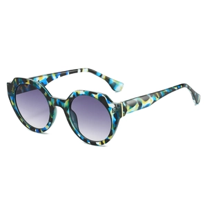 Irregular tortoise frame sunglasses with round inner rims and purple gradient lenses